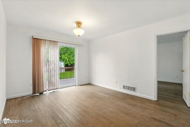 2308 Casey Cusack Loop, Anchorage, AK 99515 - empty room featuring wood finished floors and baseboards