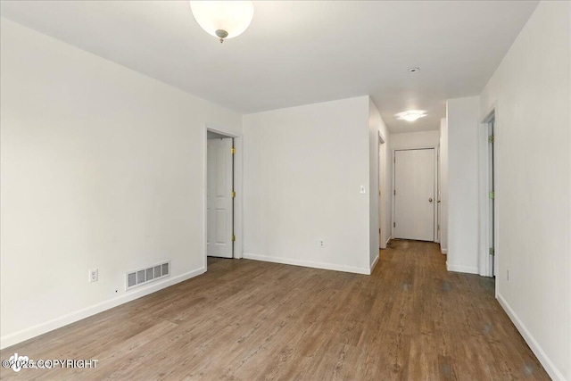 2308 Casey Cusack Loop, Anchorage, AK 99515 - unfurnished room with wood finished floors and baseboards
