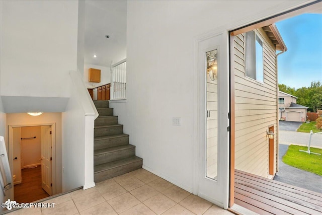 2308 Casey Cusack Loop, Anchorage, AK 99515 - staircase featuring tile patterned flooring and baseboards