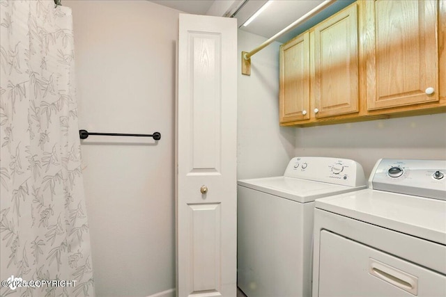 2308 Casey Cusack Loop, Anchorage, AK 99515 - laundry room with cabinet space and washer and dryer