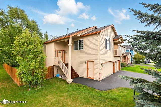 2308 Casey Cusack Loop, Anchorage, AK 99515 - rear view of property with an attached garage and driveway