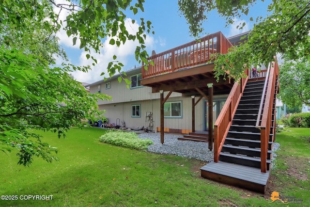 back of property with a lawn, a deck, and stairway