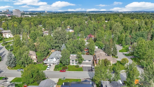 aerial view with a residential view and a view of trees