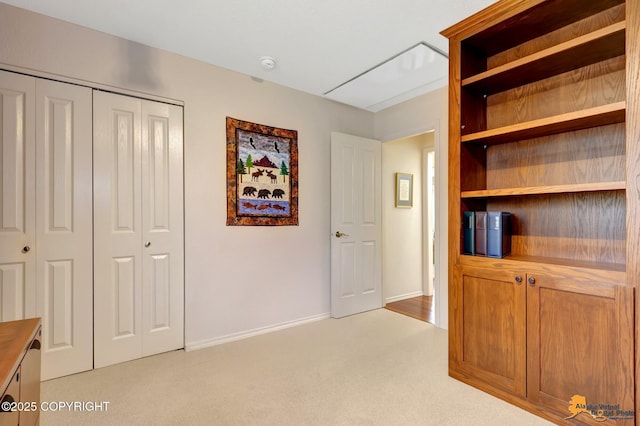 hall with carpet flooring and baseboards