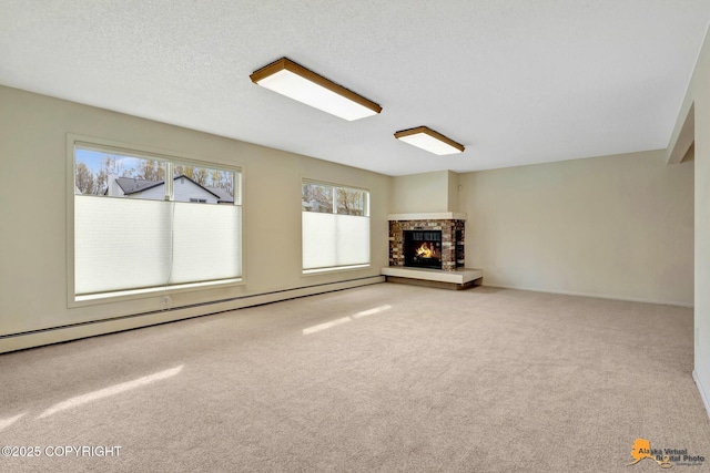 unfurnished living room featuring carpet floors, a brick fireplace, a healthy amount of sunlight, and baseboard heating