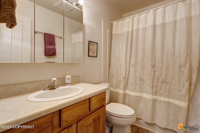 full bathroom featuring vanity and toilet