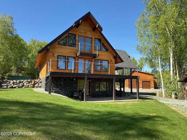 6517 S Becky Ln, Wasilla, AK 99652 - back of house featuring a lawn, driveway, and a deck