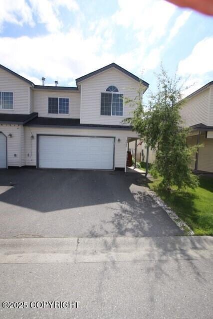 view of front of home featuring a garage and driveway