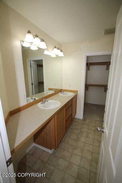 full bathroom with double vanity