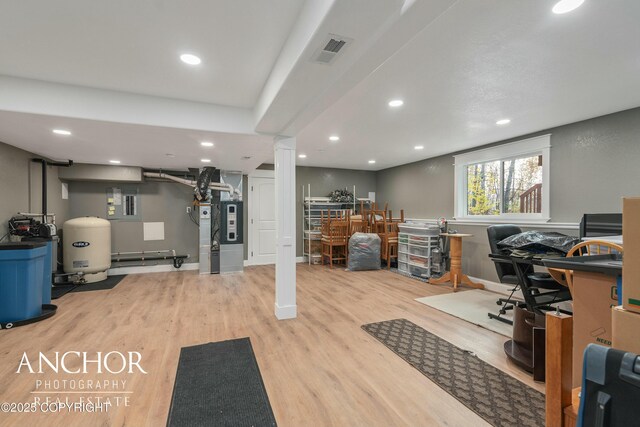 office area with visible vents, recessed lighting, decorative columns, and wood finished floors