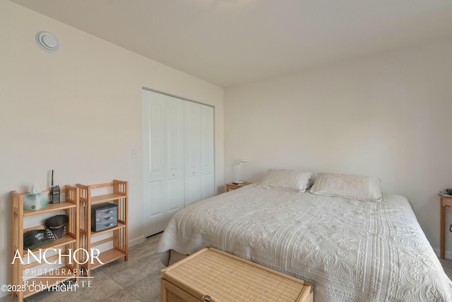 bedroom with a closet and baseboards