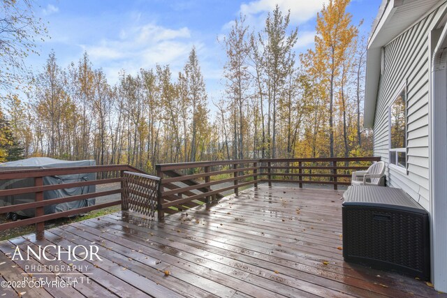 wooden deck with central air condition unit