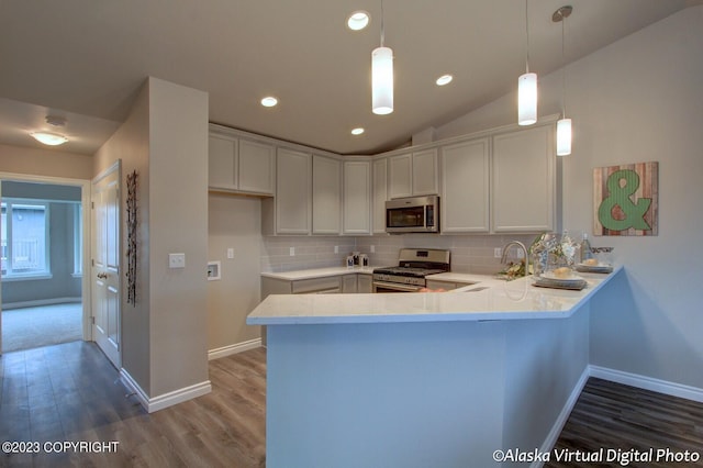 300 Shageluk St, Anchorage, AK 99504 - kitchen featuring backsplash, a sink, stainless steel appliances, and a peninsula