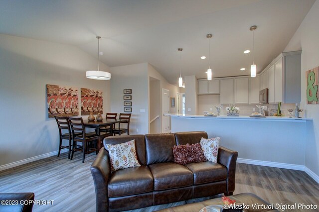 300 Shageluk St, Anchorage, AK 99504 - living area featuring recessed lighting, baseboards, vaulted ceiling, and wood finished floors