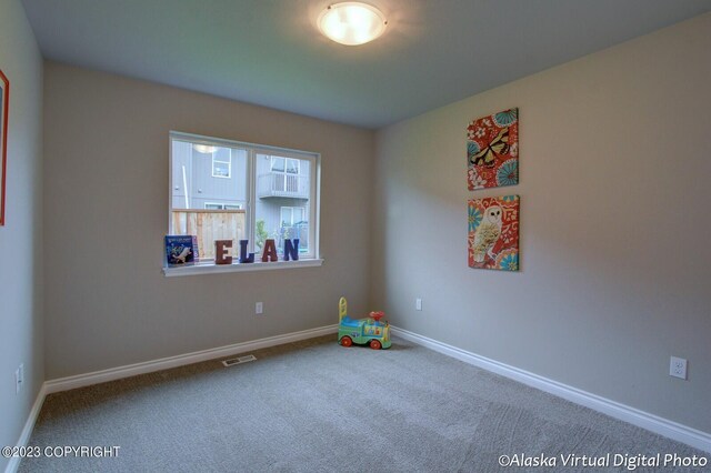 300 Shageluk St, Anchorage, AK 99504 - carpeted spare room featuring baseboards and visible vents