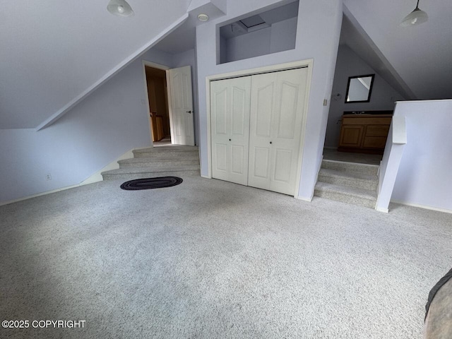 32945 Melanie Ln, Seward, AK 99664 - additional living space featuring lofted ceiling, carpet, baseboards, a sink, and stairs