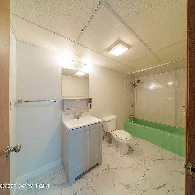 7621 E 4th Ave, Anchorage, AK 99504 - bathroom featuring marble finish floor, vanity, toilet, and baseboards