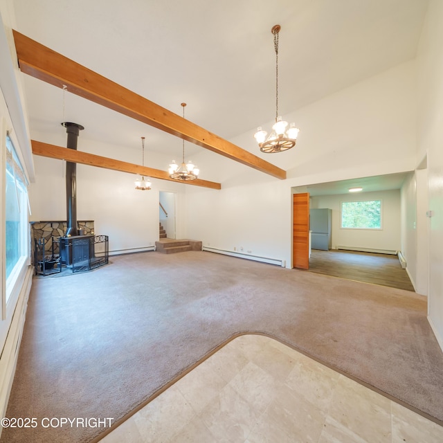 7621 E 4th Ave, Anchorage, AK 99504 - interior space featuring a wood stove, carpet flooring, beam ceiling, a baseboard radiator, and a notable chandelier