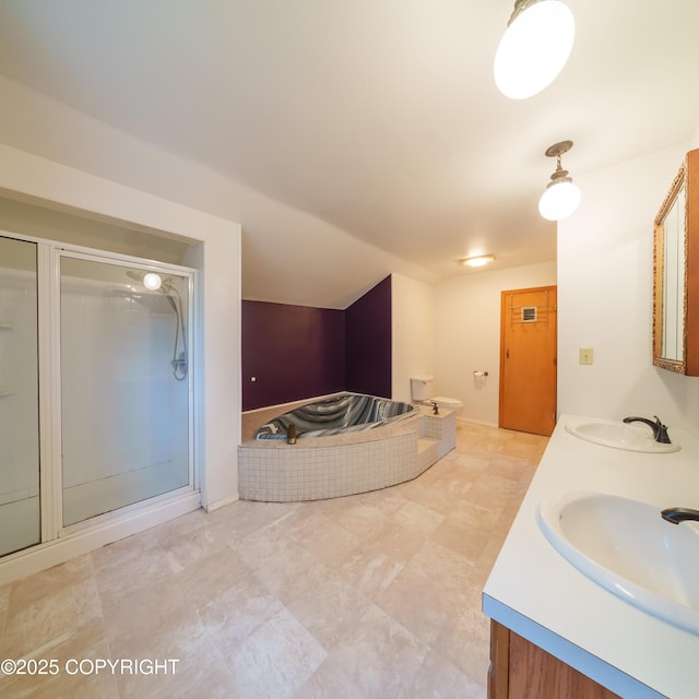 7621 E 4th Ave, Anchorage, AK 99504 - bathroom featuring a stall shower, double vanity, a sink, and a garden tub