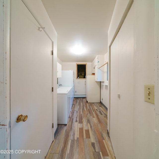 7621 E 4th Ave, Anchorage, AK 99504 - laundry area with cabinet space and light wood-style floors