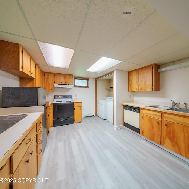 7621 E 4th Ave, Anchorage, AK 99504 - kitchen with washing machine and clothes dryer, under cabinet range hood, electric stove, a sink, and white dishwasher