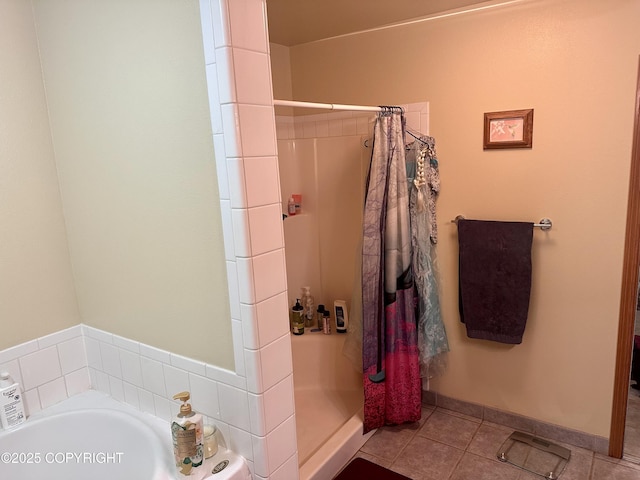 34581 N Fork Rd, Anchor Point, AK 99556 - bathroom featuring a stall shower, a bath, and tile patterned floors
