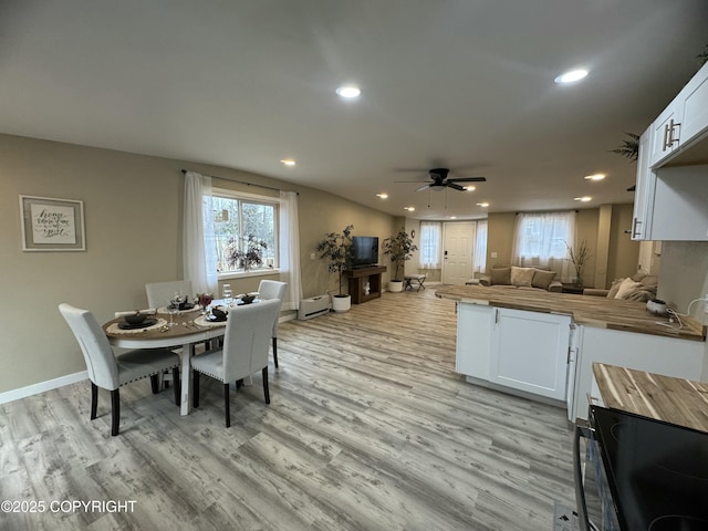 140 Standard Dr, Kenai, AK 99611 - kitchen with butcher block counters, open floor plan, a peninsula, light wood-style floors, and recessed lighting