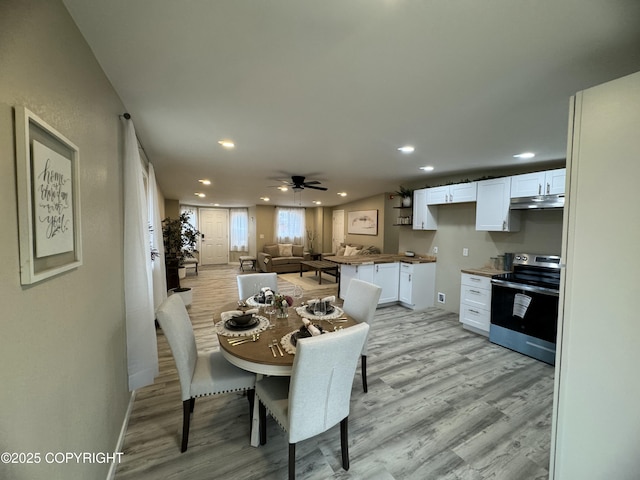 140 Standard Dr, Kenai, AK 99611 - dining room with light wood-style flooring, recessed lighting, a ceiling fan, and baseboards