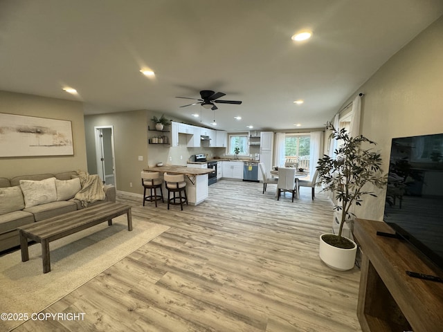140 Standard Dr, Kenai, AK 99611 - living room with light wood finished floors, recessed lighting, a ceiling fan, and baseboards