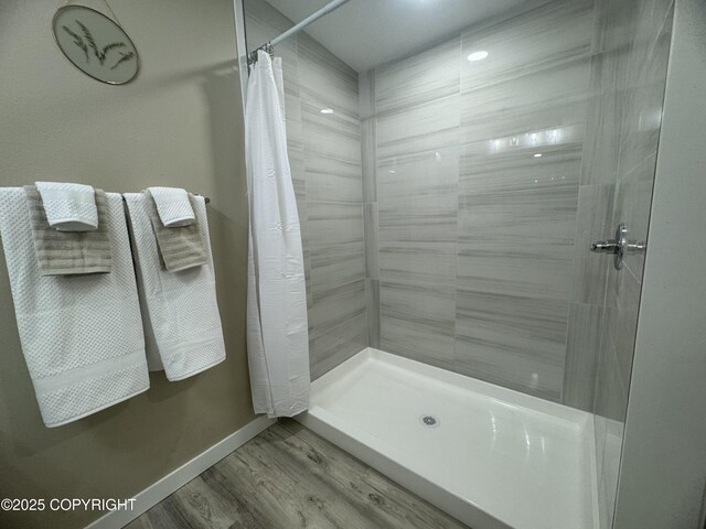 140 Standard Dr, Kenai, AK 99611 - bathroom with a stall shower, wood finished floors, and baseboards