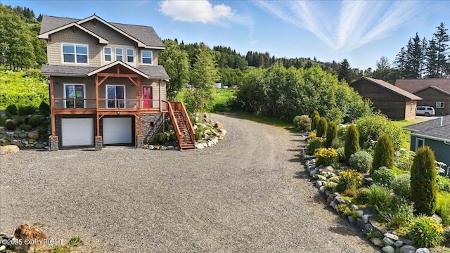 3866 Cabana Ct, Homer, AK 99603 - view of front of house featuring stairs, driveway, and an attached garage