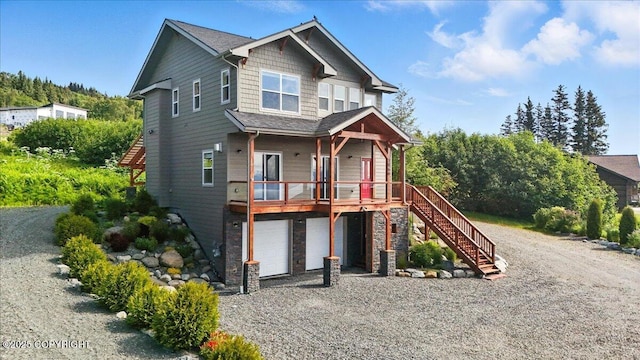 3866 Cabana Ct, Homer, AK 99603 - craftsman inspired home with gravel driveway, stairway, stone siding, and an attached garage