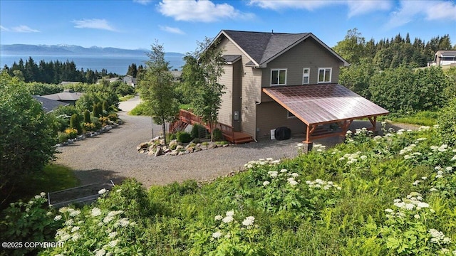3866 Cabana Ct, Homer, AK 99603 - view of side of home featuring driveway and a water and mountain view