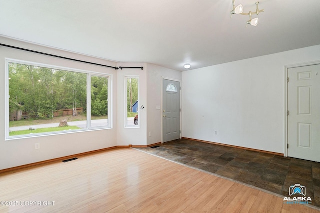 19306 Second St, Eagle River, AK 99577 - entrance foyer featuring baseboards, a chandelier, and stone finish flooring
