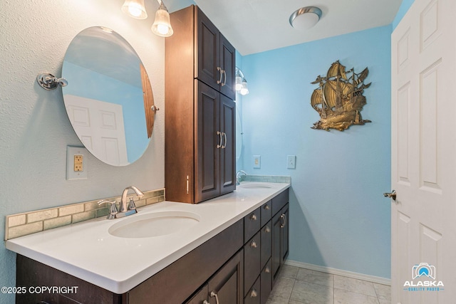 19306 Second St, Eagle River, AK 99577 - full bathroom with double vanity, baseboards, and tile patterned floors