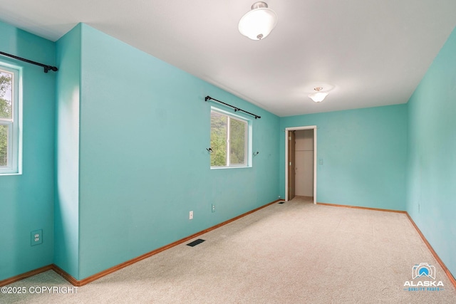 19306 Second St, Eagle River, AK 99577 - carpeted empty room featuring healthy amount of natural light and baseboards
