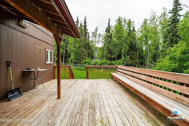19306 Second St, Eagle River, AK 99577 - wooden deck with view of wooded area and a lawn