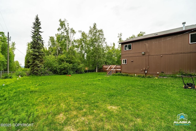 19306 Second St, Eagle River, AK 99577 - view of green lawn with a deck