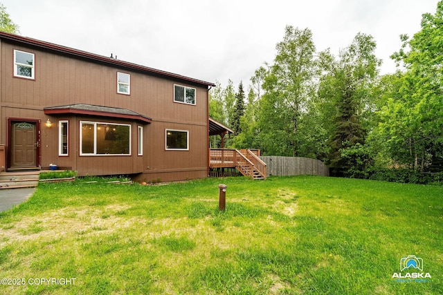 19306 Second St, Eagle River, AK 99577 - view of green lawn with stairway and a deck