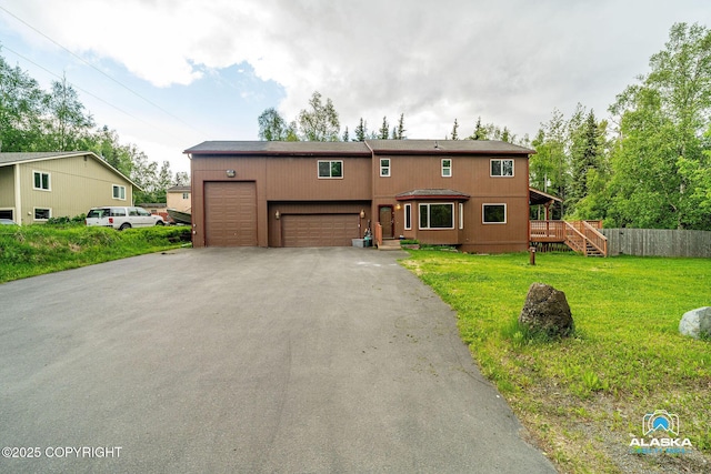 19306 Second St, Eagle River, AK 99577 - view of front of property with asphalt driveway and a garage