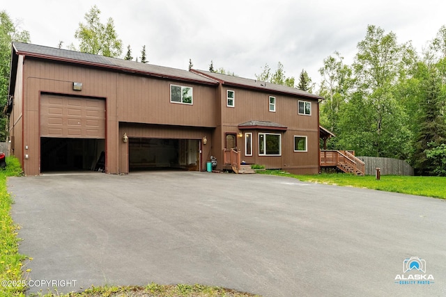 19306 Second St, Eagle River, AK 99577 - view of front of property featuring a garage and driveway