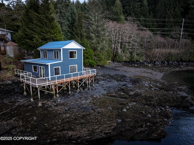 5751 N Tongass Hwy, Ketchikan, AK 99901 - rear view of house with a wooden deck and a wooded view