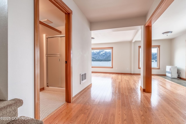 5751 N Tongass Hwy, Ketchikan, AK 99901 - hallway featuring baseboards, visible vents, and wood finished floors