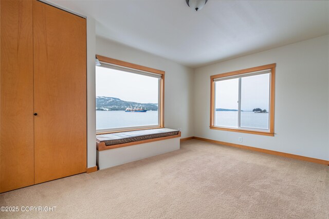 5751 N Tongass Hwy, Ketchikan, AK 99901 - unfurnished bedroom featuring baseboards and carpet floors