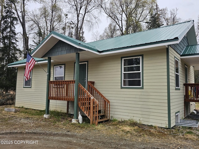 view of front of property with metal roof and a porch