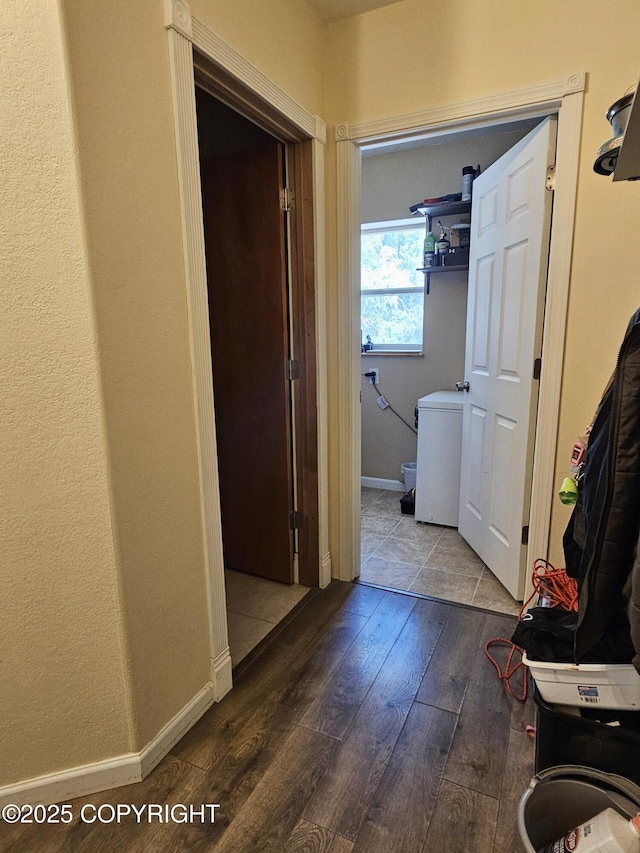 hallway with hardwood / wood-style flooring and baseboards