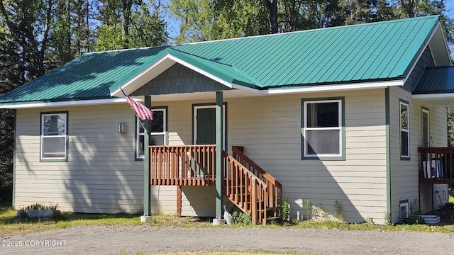 53696 Jeffrey Ave, Nikiski/North Kenai, AK 99611 - bungalow-style home with a porch and metal roof