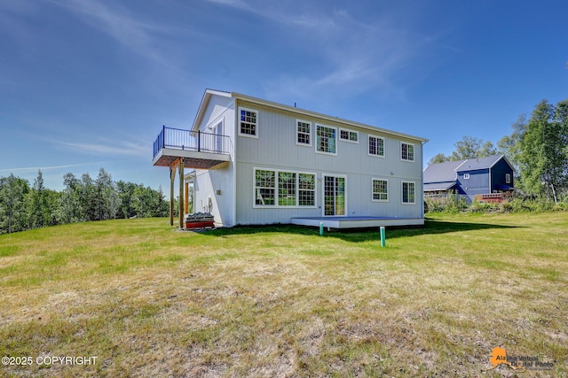 8007 S Knik Knack Mud Shack Rd, Wasilla, AK 99623 - back of house with a yard, a balcony, and a deck