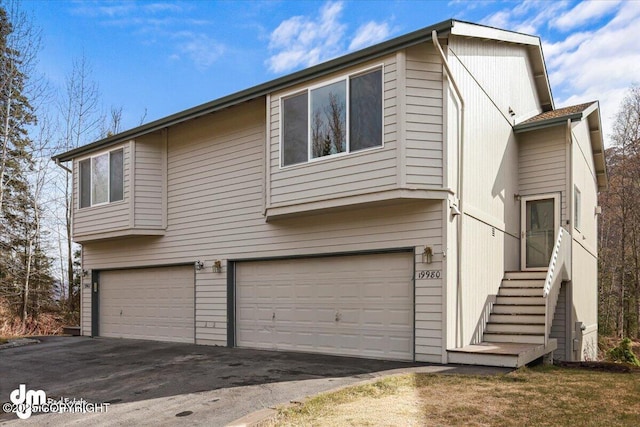 view of front of property featuring a garage and driveway