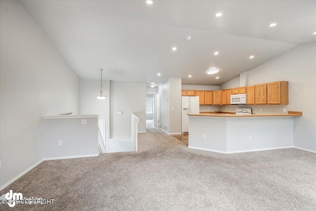 kitchen with baseboards, vaulted ceiling, light carpet, and white appliances